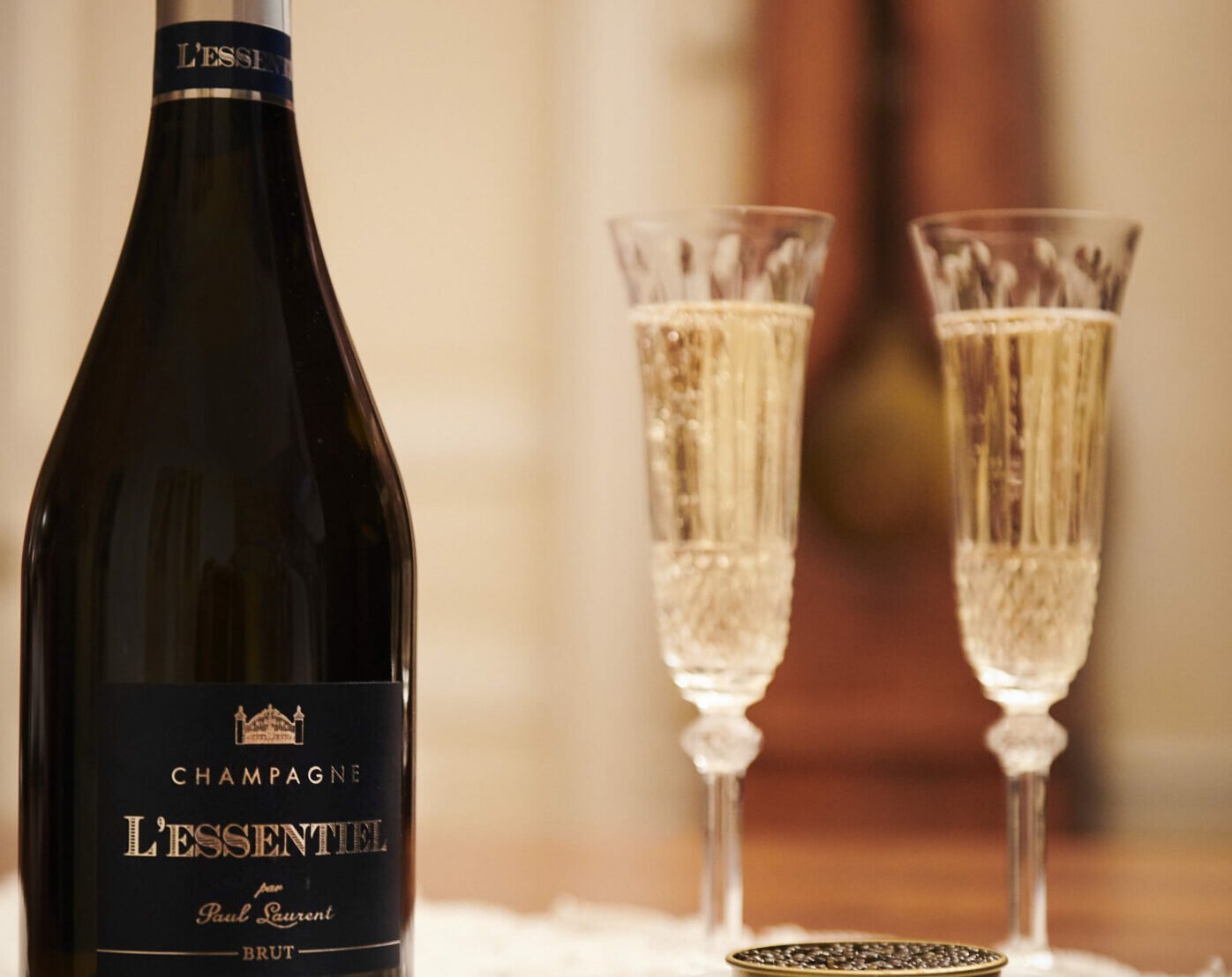 Cuvée L'Essentiel served with caviar and two champagne glasses